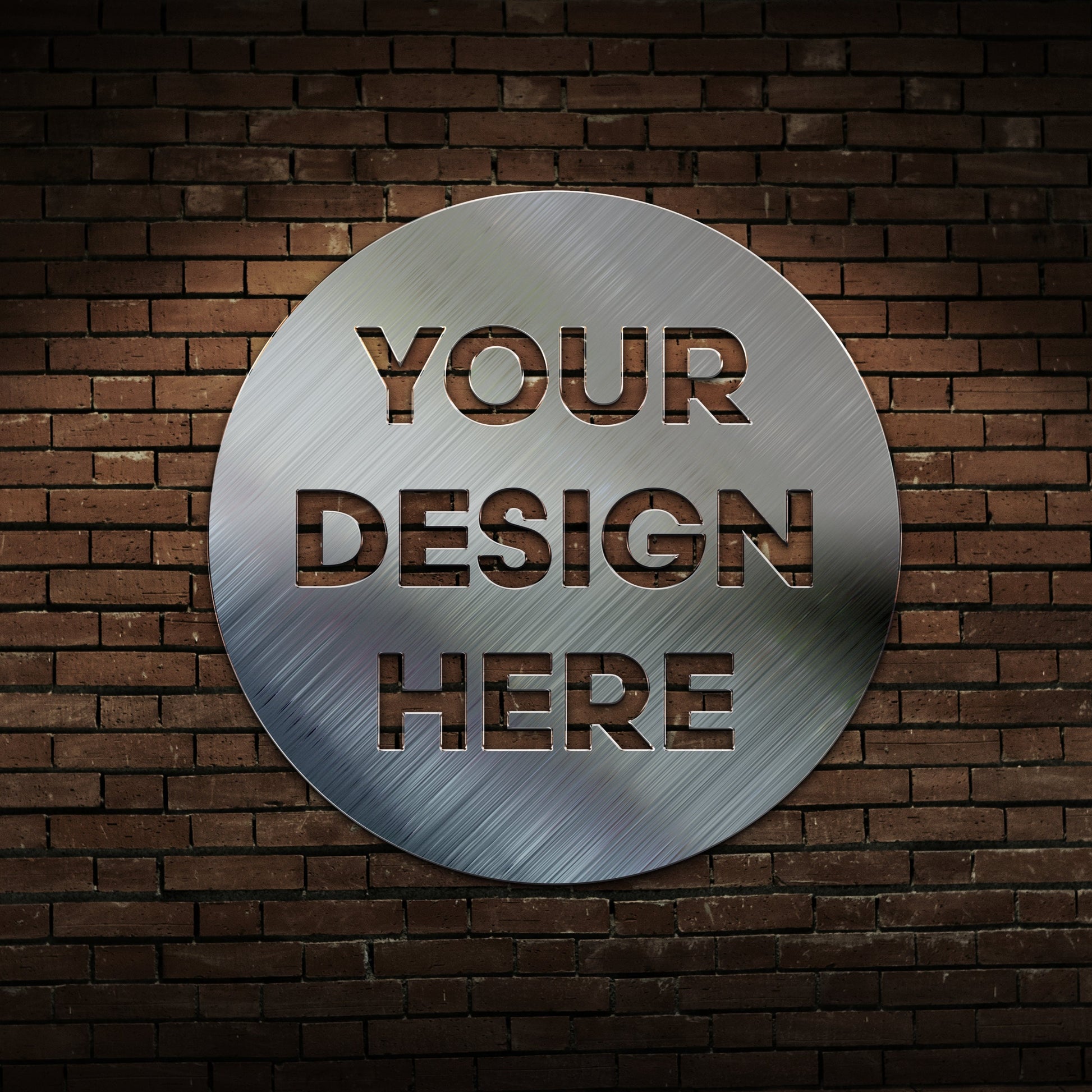 brushed silver circle on a brick wall