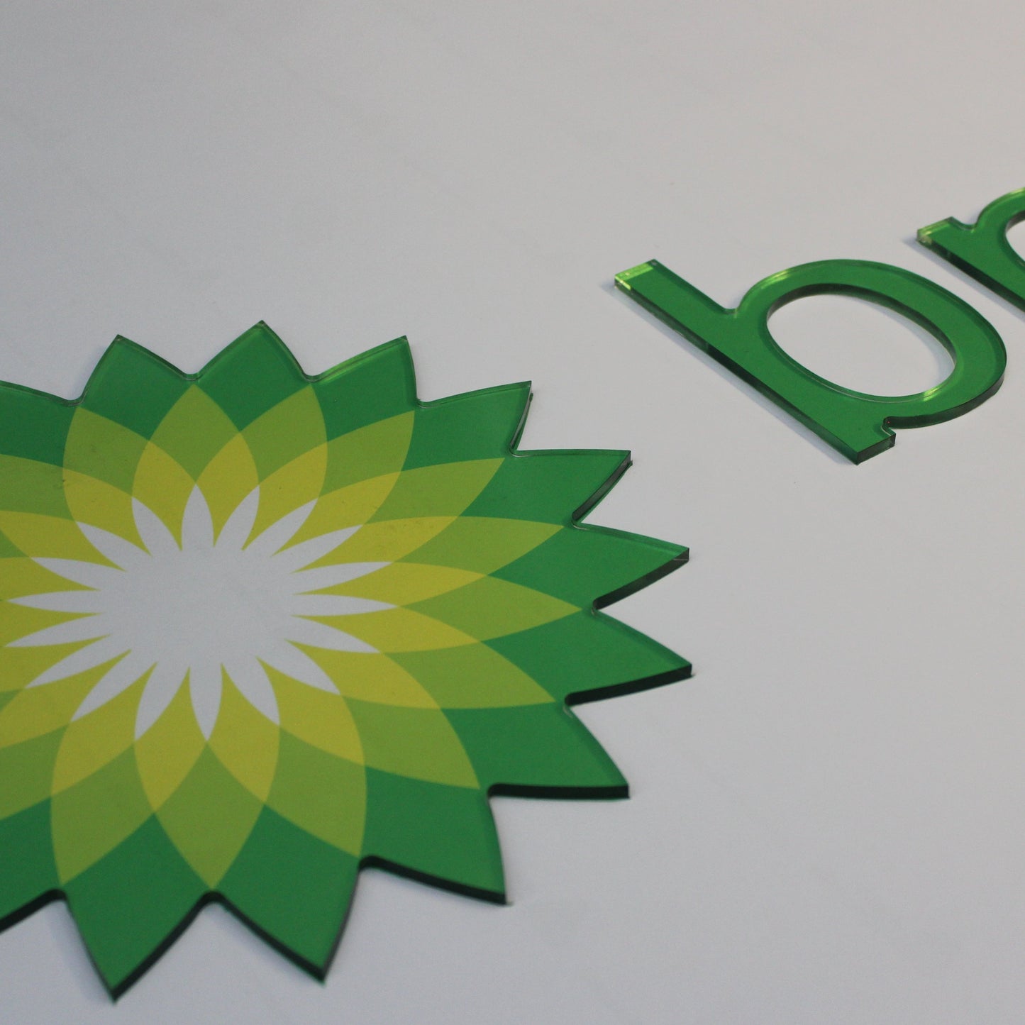 close up of a green and yellow logo 5mm thick