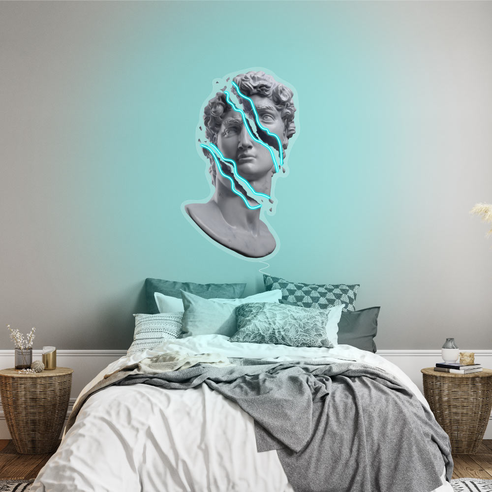 a printed head with blue leds hanging on a wall