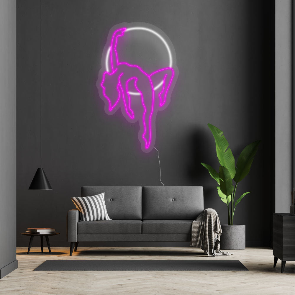 neon sign ariel artist on a wall