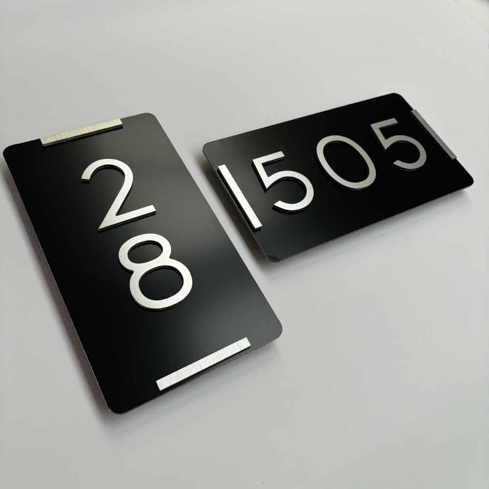 Black backing sign with Brushed Silver lettering