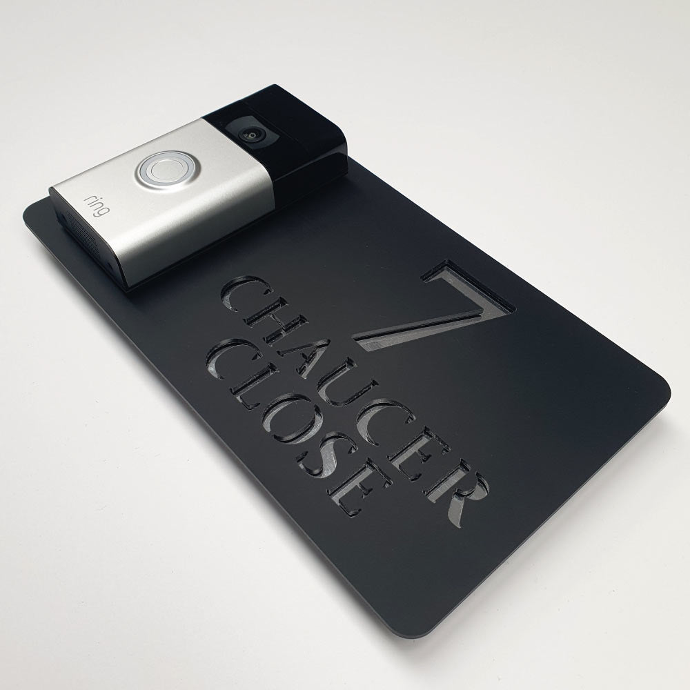 ring doorbell house plaque in a black and silver finish