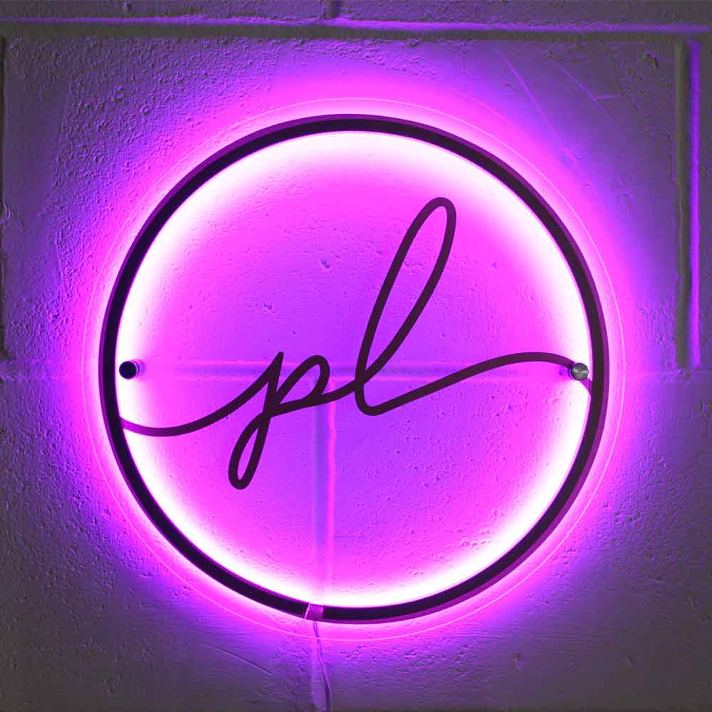 illuminated business sign in pink round acrylic wall plaque
