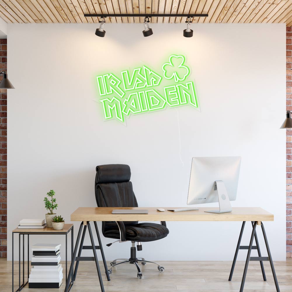 a green sign on a white wall office