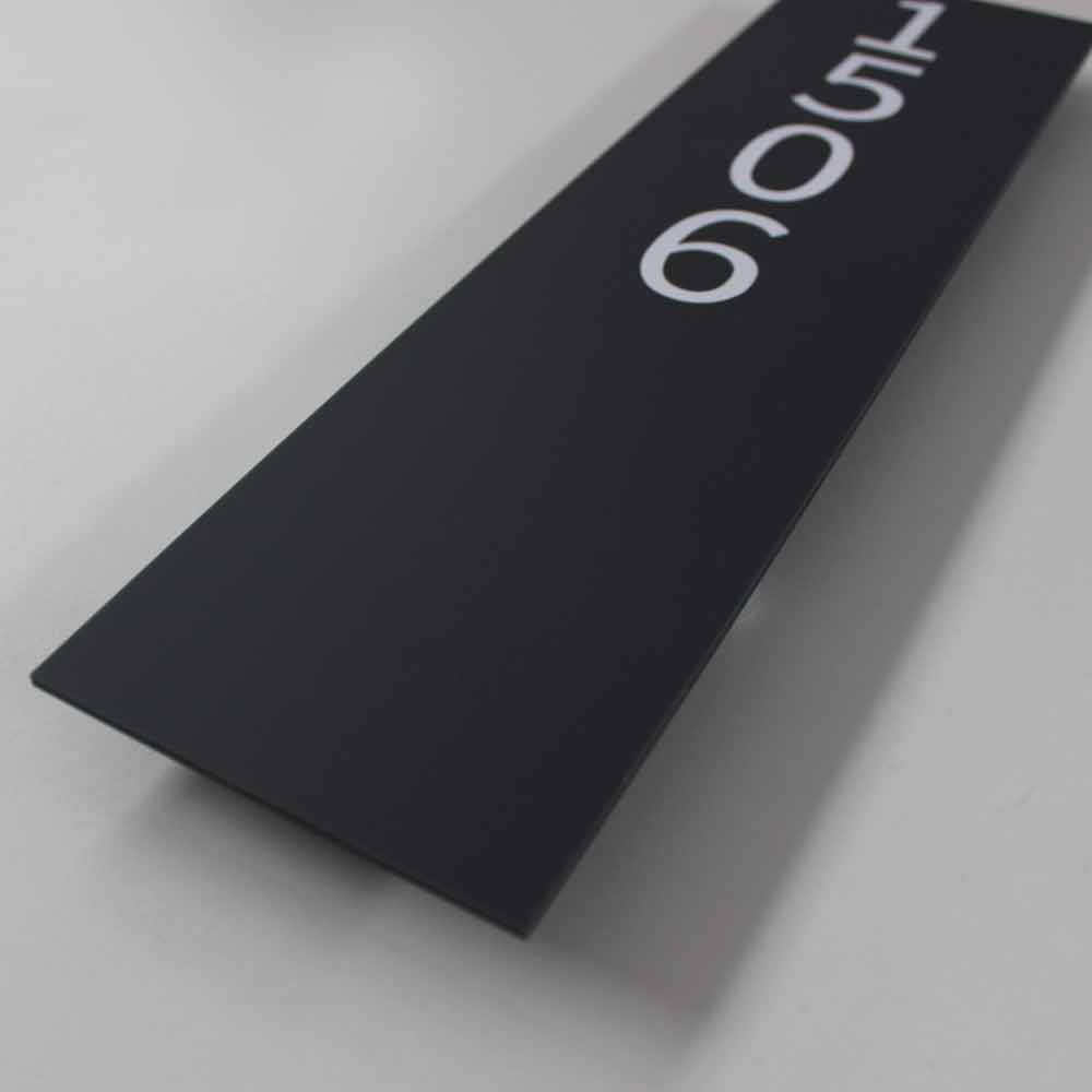 side view of this house sign with white numbers