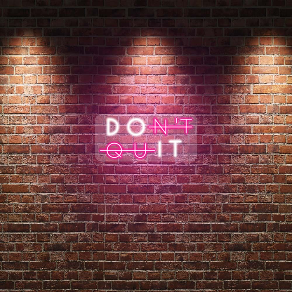 pink and white lights on a brick wall gym