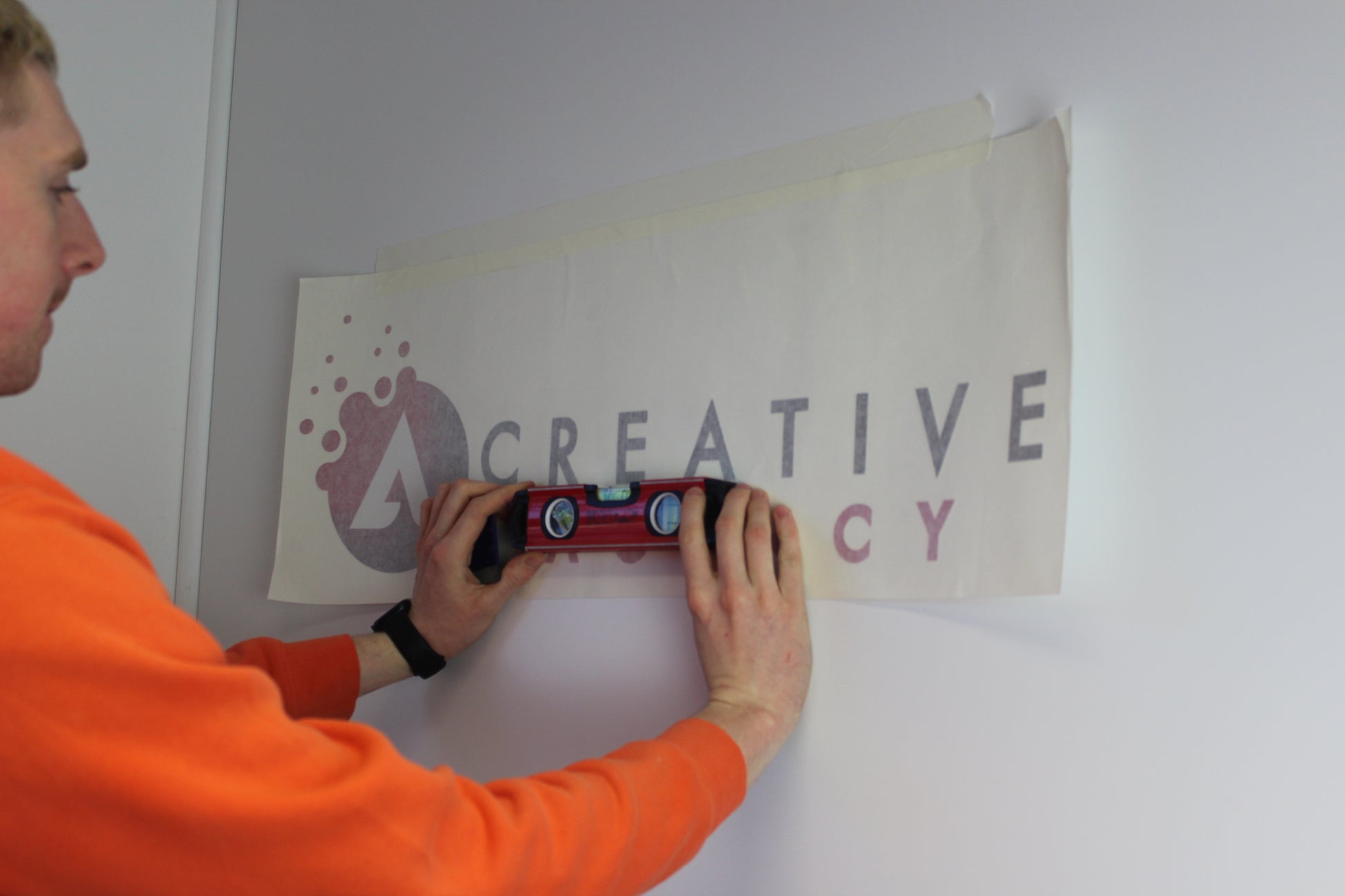 an example of fitting a printed wall logo