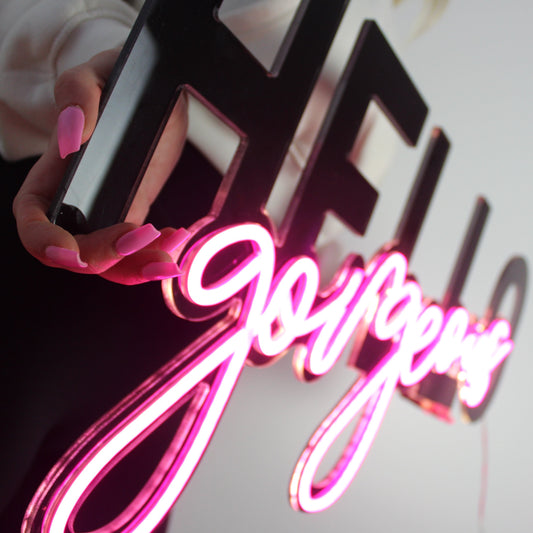 hello gorgeous neon sign with black and bright pink