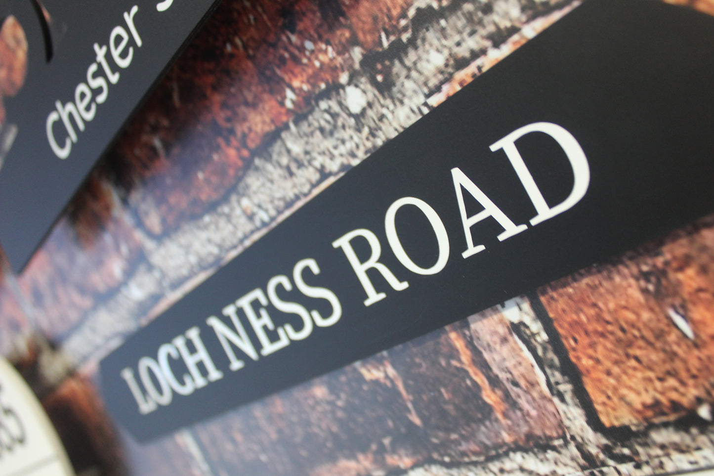 Personalised gate sign in black and white writing