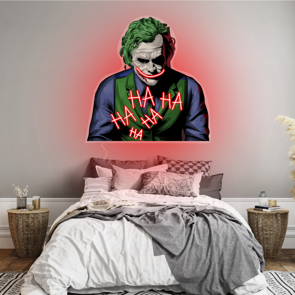 a joker neon sign with red grin and ha ha ha