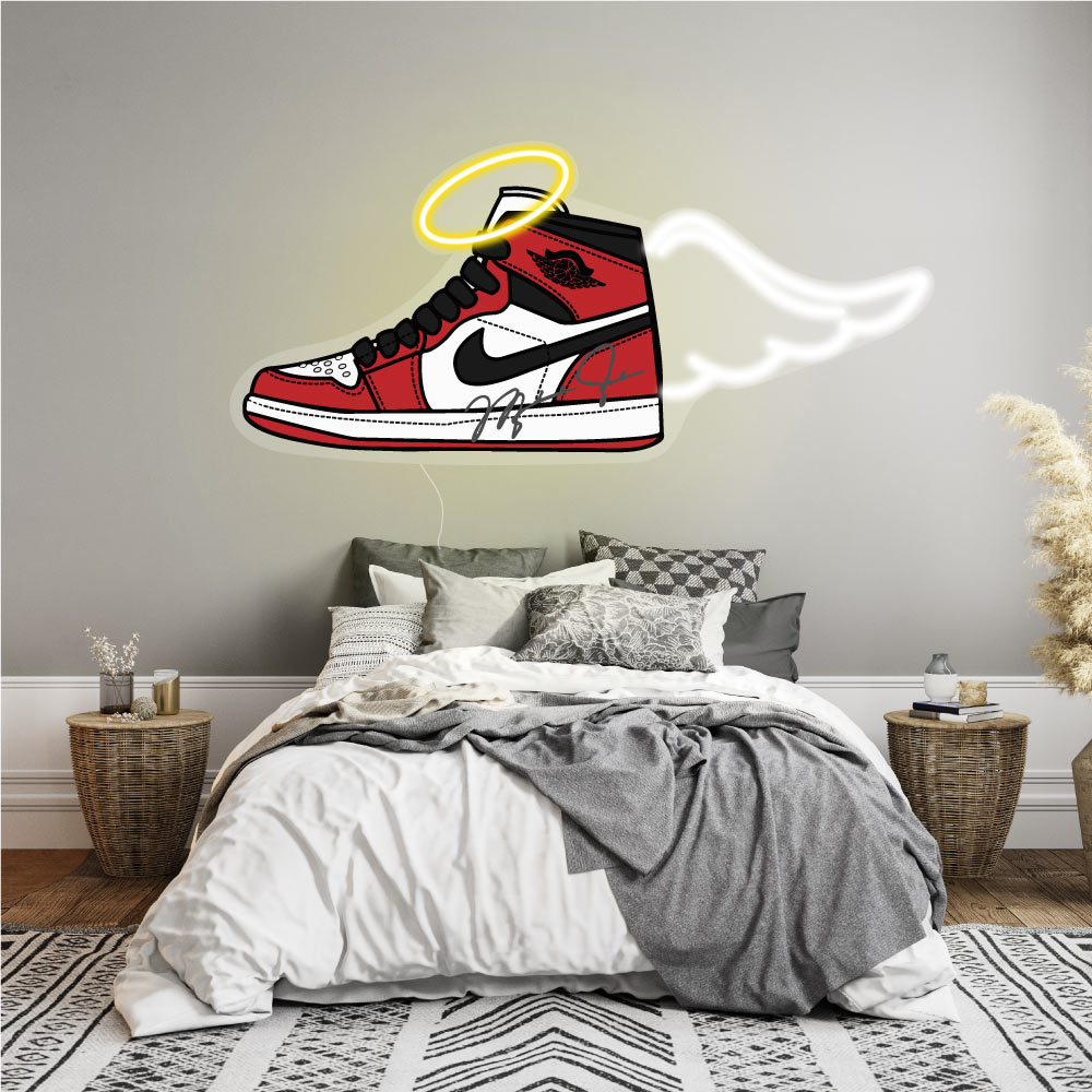 sneaker neon sign above a bed