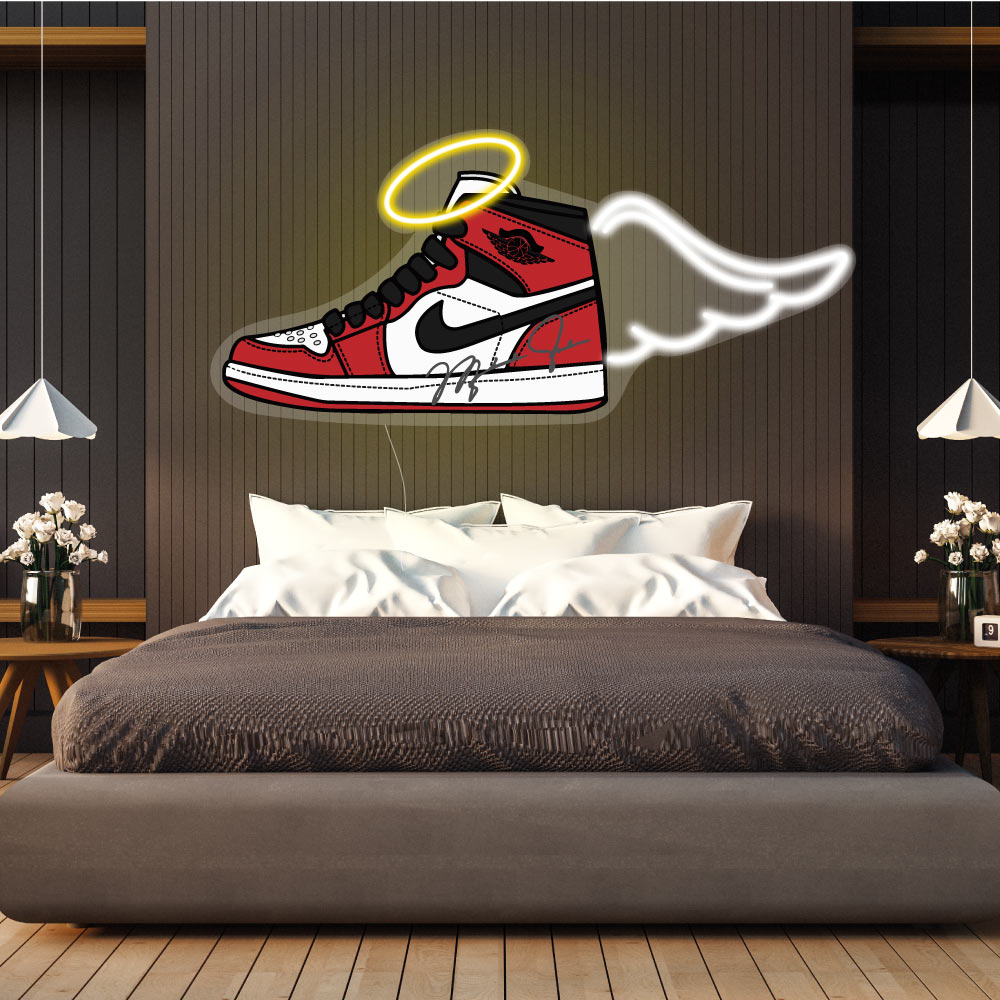 nike jordan  neon sign above a brown bed on a wall