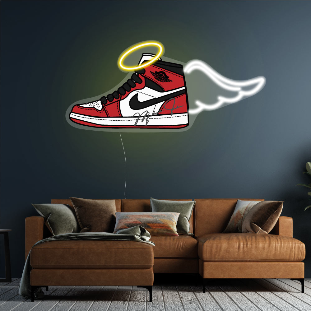 treainer neon sign above a brown couch 