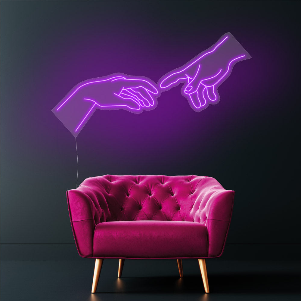 hand of god neon sign in a purple light hanging above a chair