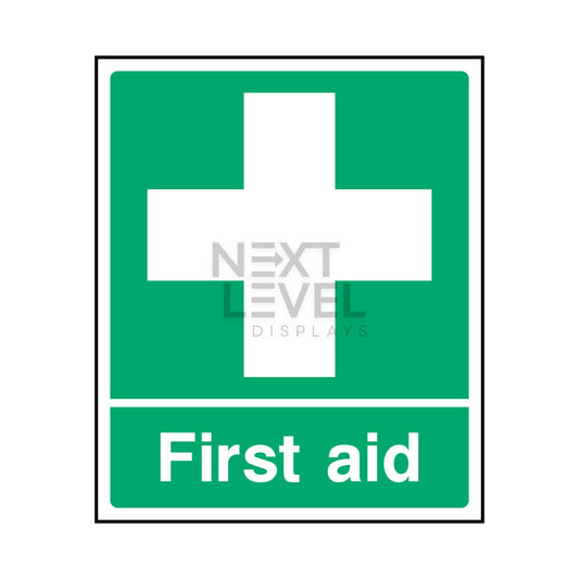 a green sign with white cross in centre
