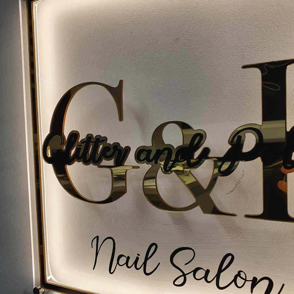 glitter and polish nail salon sign