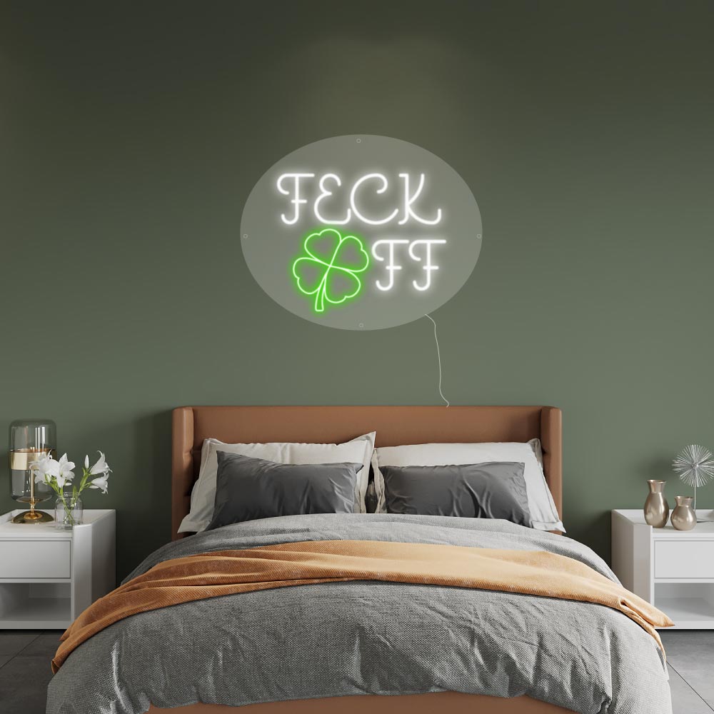 a neon sign with irish humour on a bedroom wall