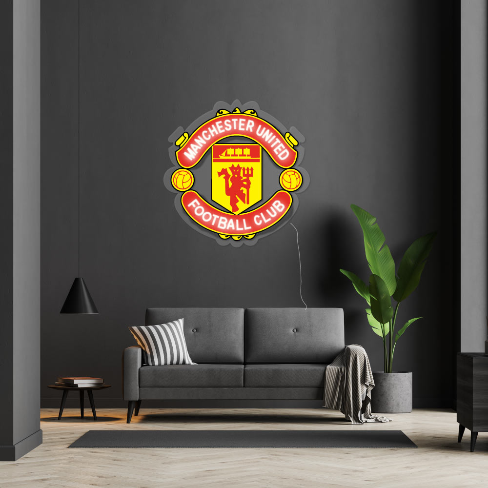 a manchester united football club neon hanging on a wall