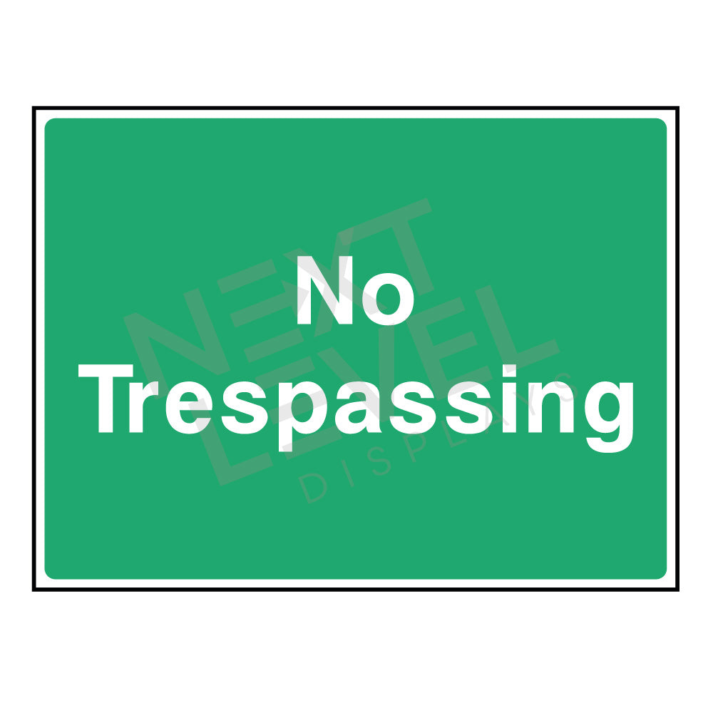 a green trespassing sign in green with white writing