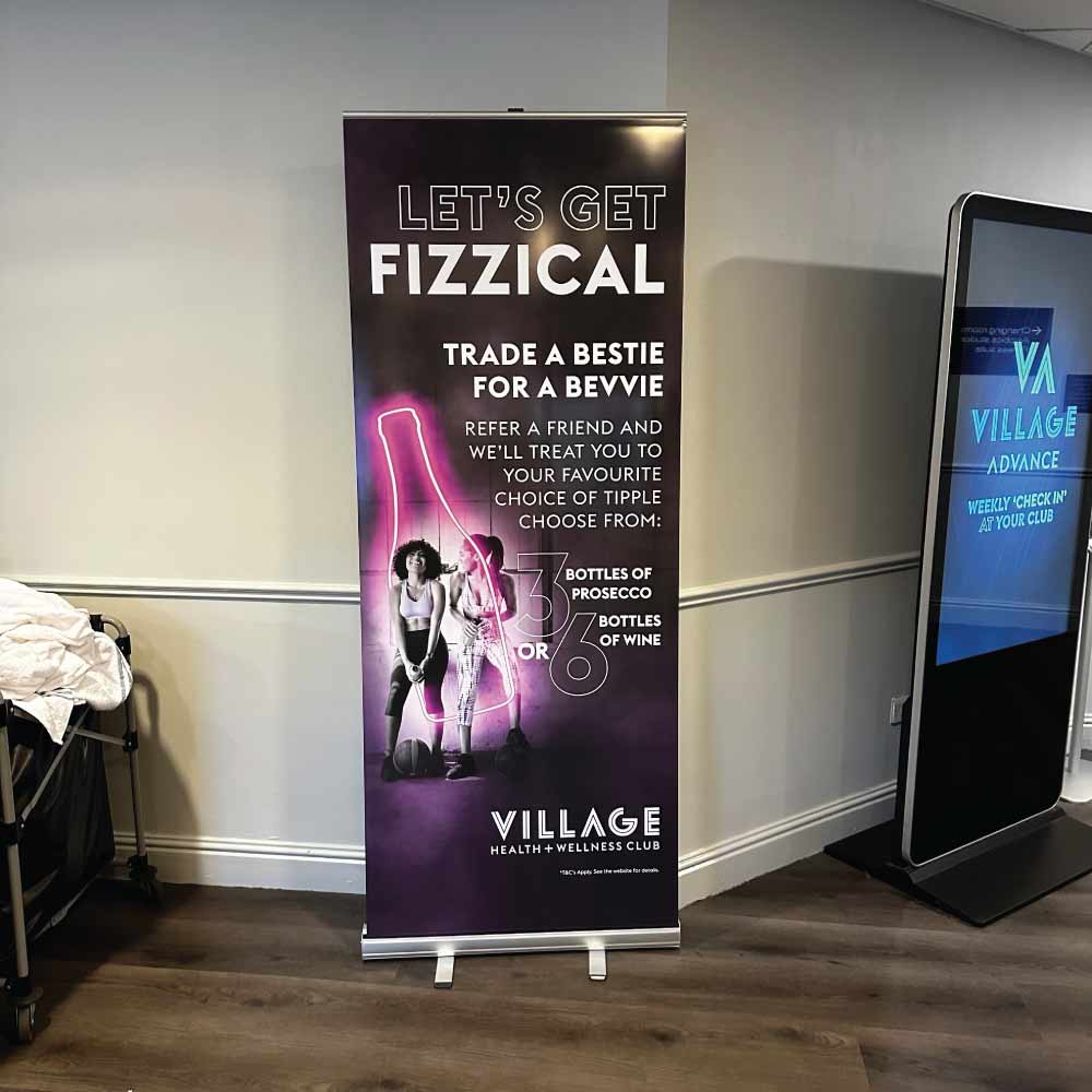 a gym roller banner advertising classes