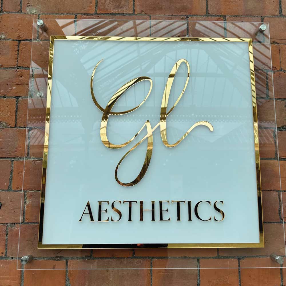 example of a acrylic sign with white vinyl and mirror gold vinyl accents